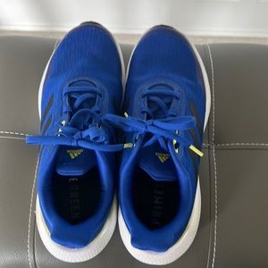 Girls’ size 7 adidas tennis shoe.  Royal blue with yellow accent. Worn once.